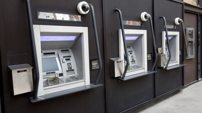 ATMs are pictured along Queen Street in Toronto in 2015.