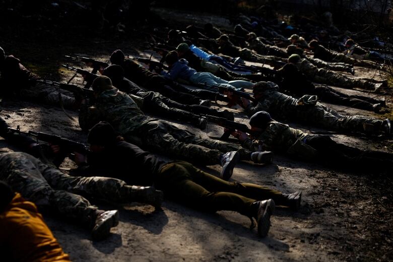 Potential recruits of the Ukrainian military are seen taking part in a training court in Kyiv.