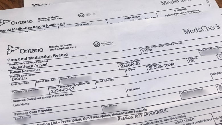 Paperwork from the Ontario government showing a MedsCheck for Marg Davies sits on a table. 