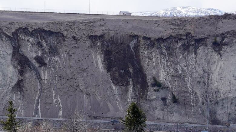 A slope with a mountain in the background 