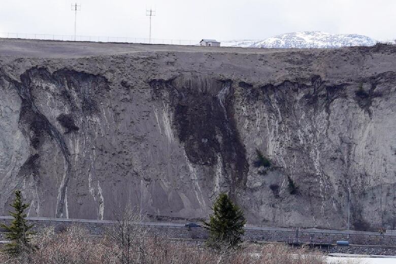 A slope with a mountain in the background 