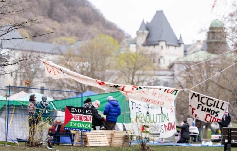 photo of signs and tents infront of mcgill campus