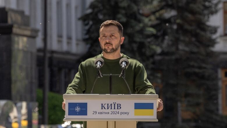 Ukrainian President Volodymyr Zelenskyy is seen speaking at a press conference in Kyiv.