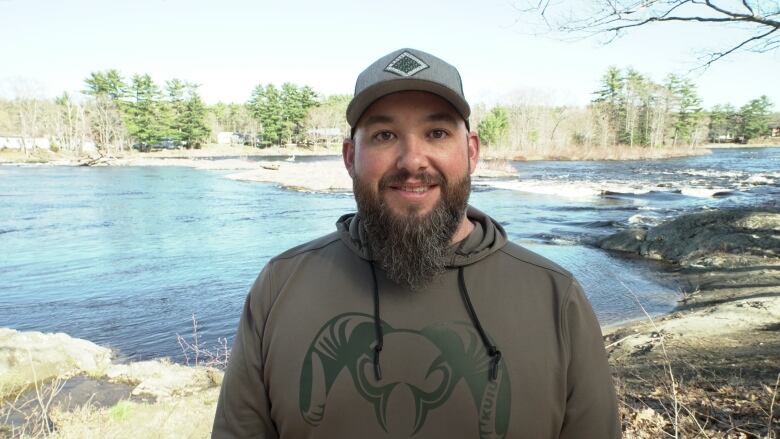 Man in front of river