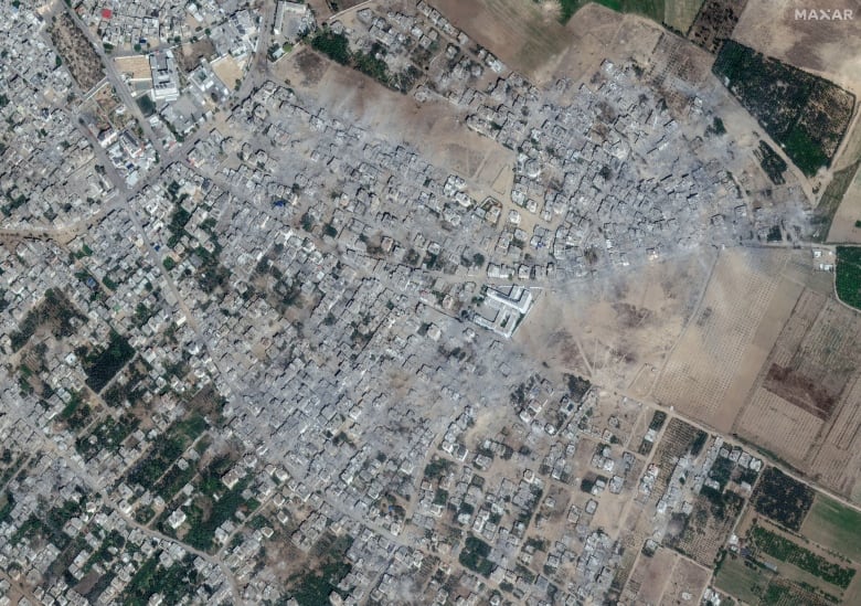 A satellite image showing a swathe of destroyed buildings in a Gaza neighbourhood.