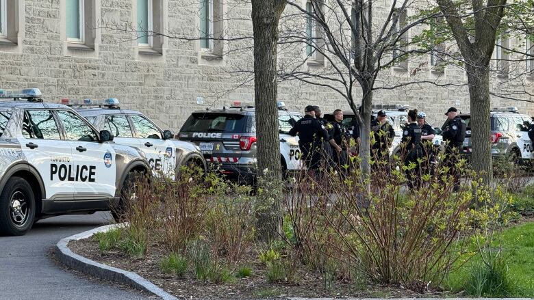 Toronto police officers and cruisers on U of T campus