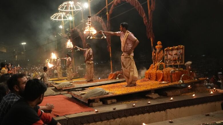 Hindu priests perform a nightly fire ritual on the banks of the holy Ganges river.