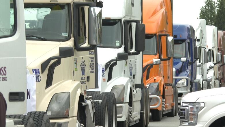 A line of semi-truck cabs.