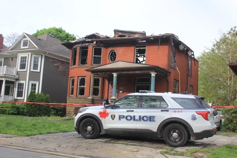 A Windsor police cruiser sits out front of 849 Victoria Ave., that caught fire early Monday morning.