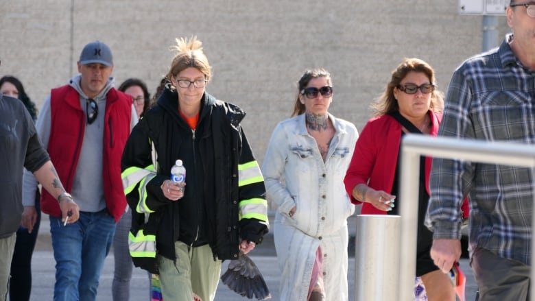 A group of people walking.