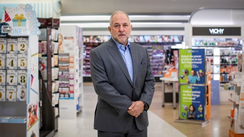 A man stands in a drug store