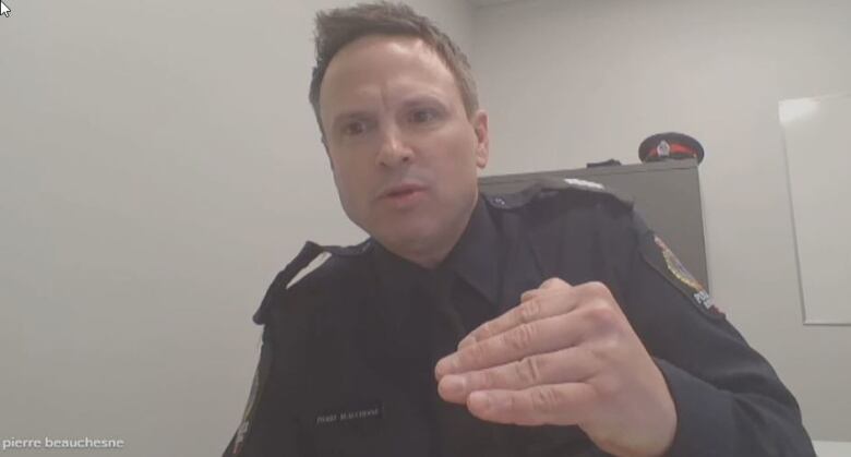 A police officer at a desk.