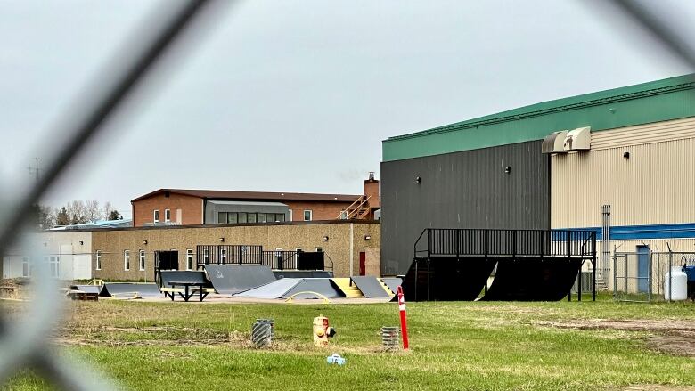 A skatepark pictured behind a chainlink fence