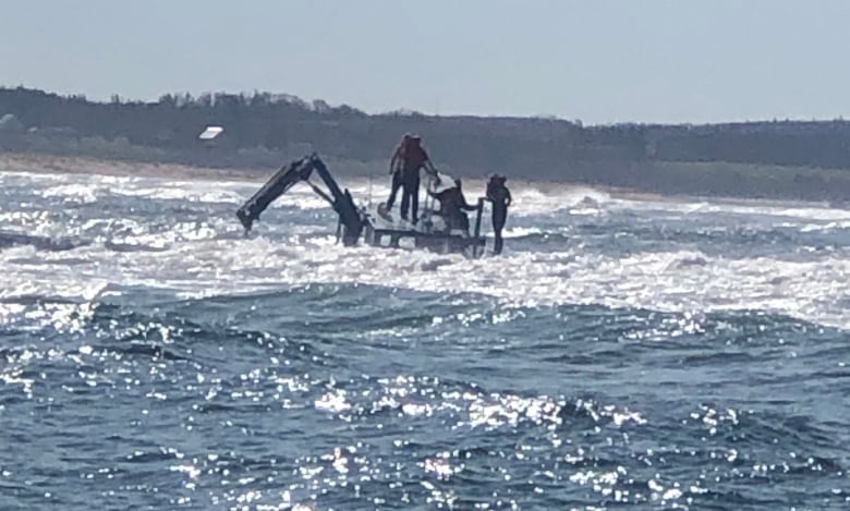 Five crew members scrambled to the top of their sinking mussel boat after it ran aground in Malpeque Harbour