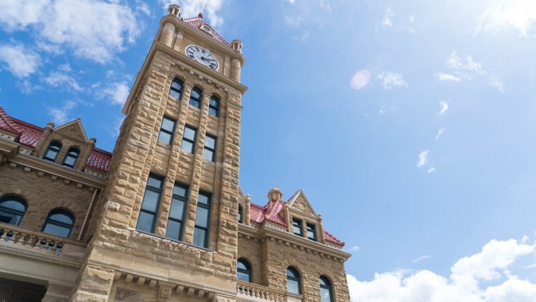 a shot of a building from a low angle. a blue sky in the background.