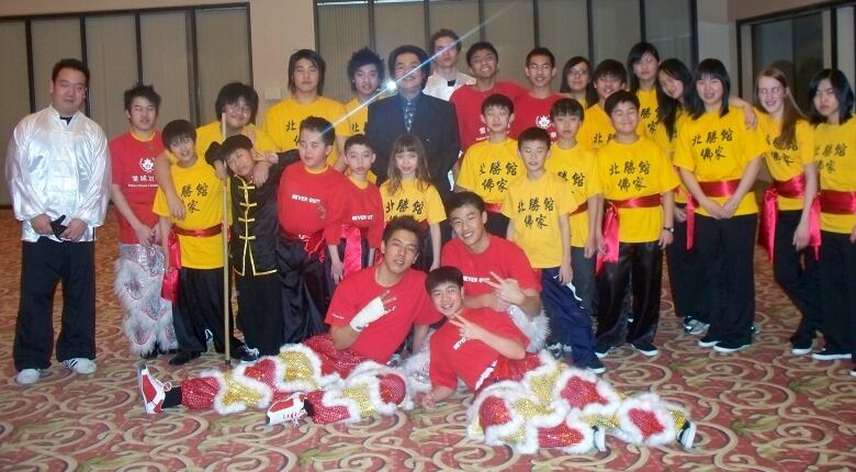 Chan, sixth from the left, and Suen, right of Chan, with their Bak Hsing Kwoon class after performing for Chinese New Year celebrations at the Delta Hotel in Regina. 