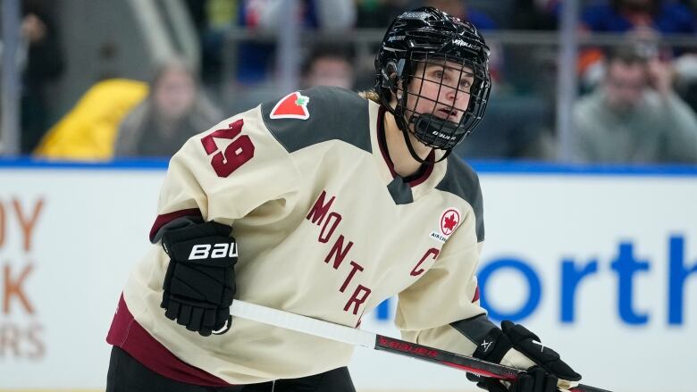 Hockey player skates down the ice