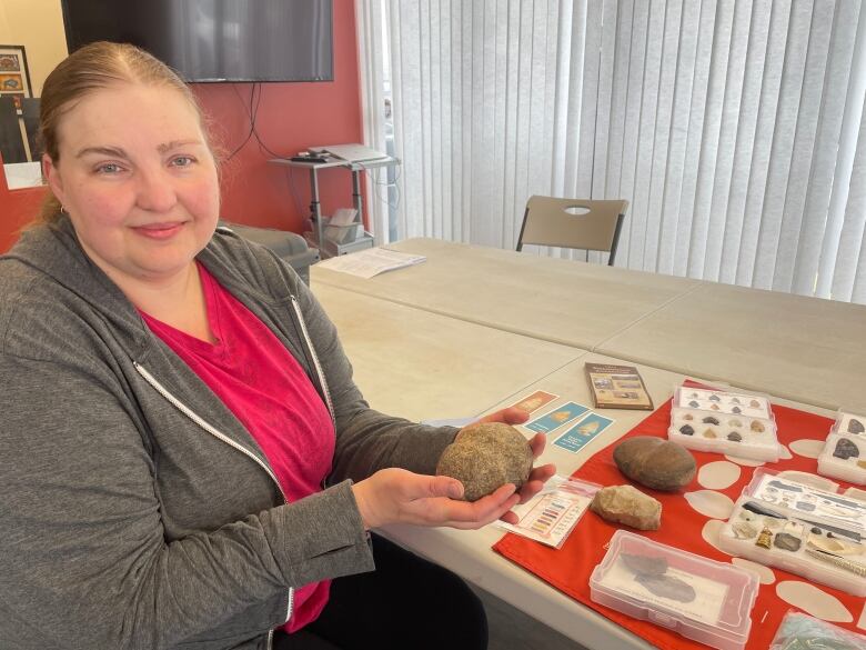 woman with rocks and arrowheads