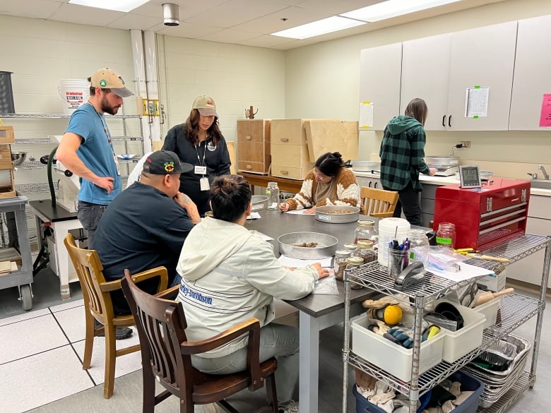 People around a table at the tree seed centre