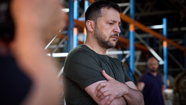 Ukrainian President Volodymyr Zelenskyy visits a damaged factory in Kharkiv, Ukraine.