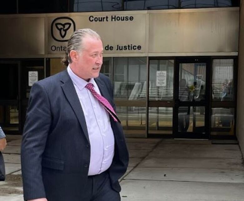 Former Woodstock mayor Trevor Birtch leaving court in downtown London, Ont., on Monday. 