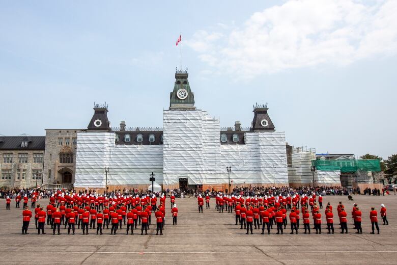 Over 170 graduation officer cadets march on the parade square before the Royal Military College Commissioning Parade in Kingston, Ontario, on Friday May 19, 2023. THE CANADIAN PRESS/Lars Hagberg