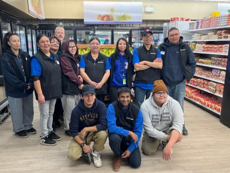 Team members pose for a group photo.