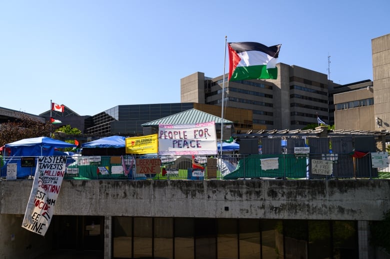 Pro-Palestinian placards at a protest encampment outside the University Community Centre on Western University's campus in London, Ont. on May 30, 2024.