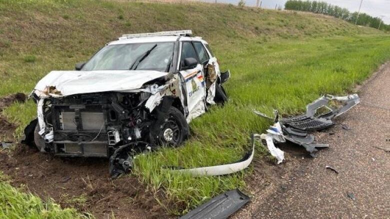 A damaged RCMP vehicle in a ditch.