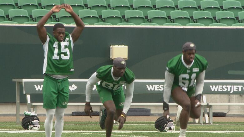 Football players stretching