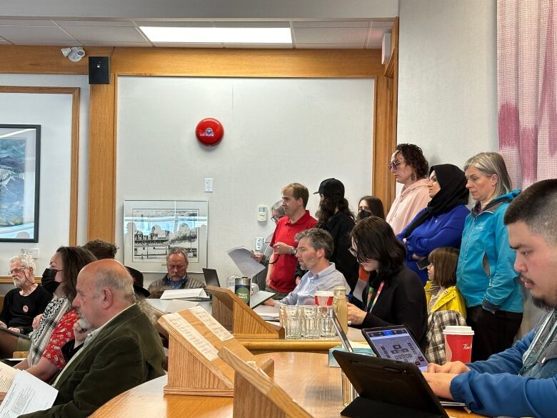 Those that couldn't find a seat stood to listen at Monday's city council meeting in Whitehorse. 