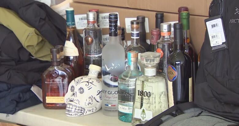 An array of stolen goods showing an assortment of high-end liquor.