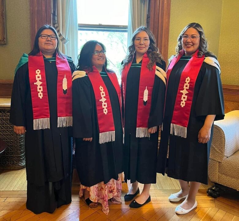 A group of friends in graduation gowns