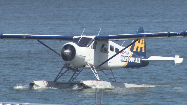 A seaplane with the words 'Harbour Air' along its side.