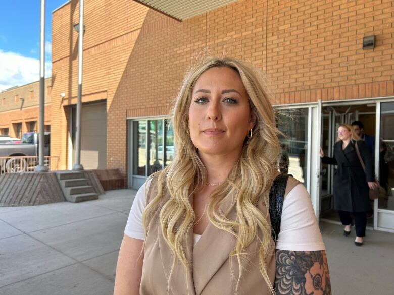 A woman outside court.