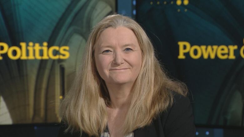 woman smiling at camera in power and politics studio