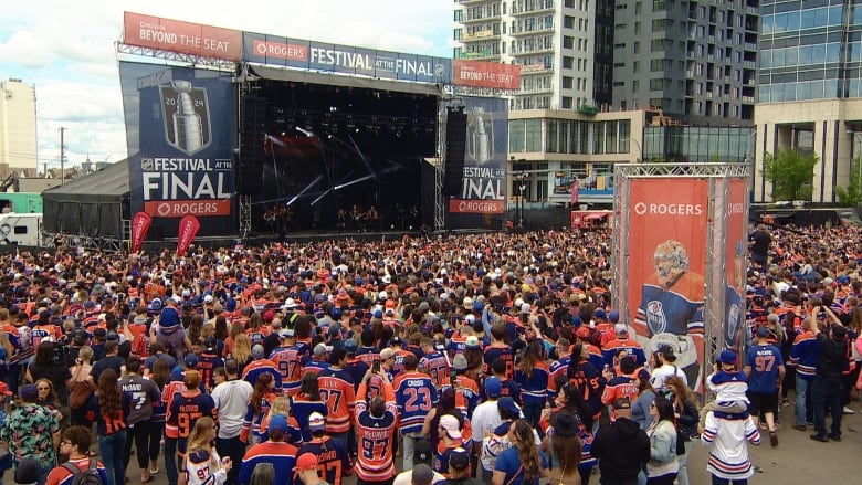 People surround a stage