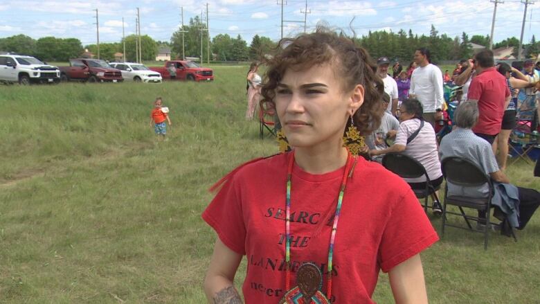 A woman in a red shirt