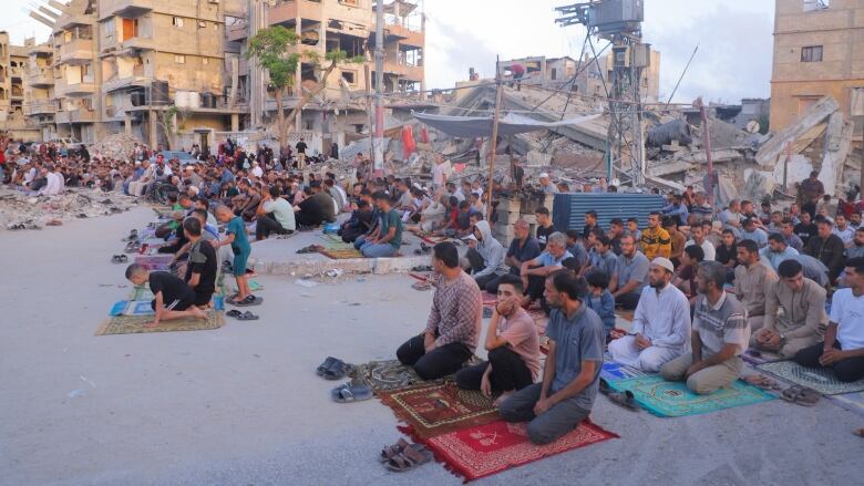 Displaced Palestinians in Khan Younis, Gaza offer Eid al-Adha prayers.