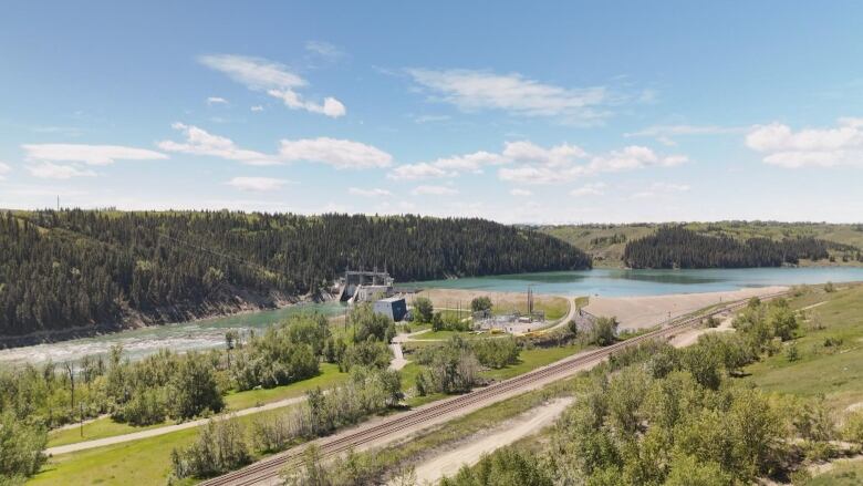 an aerial view of a water treatment plant building on the water.