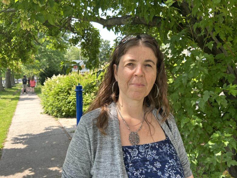 Woman standing in front of tree