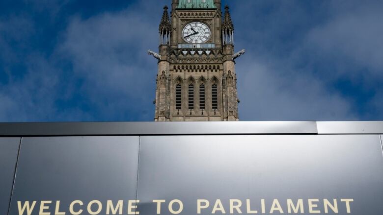 The Peace tower is seen above a welcome sign as politicians begin returning to work in Ottawa, Tuesday, Oct. 5, 2021. The Conservative and Bloc parties both held their first party caucus following the federal election.