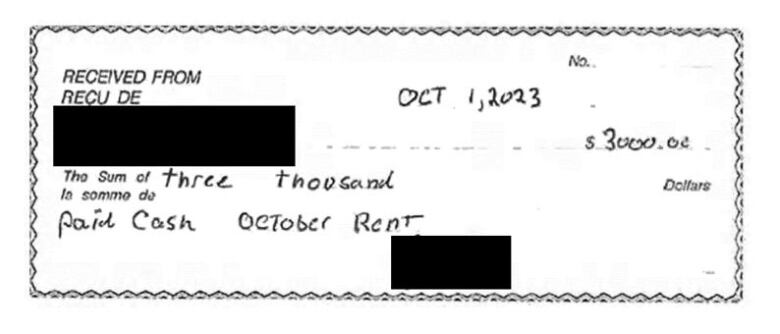 An image of a cheque with the receiver's name blacked out.