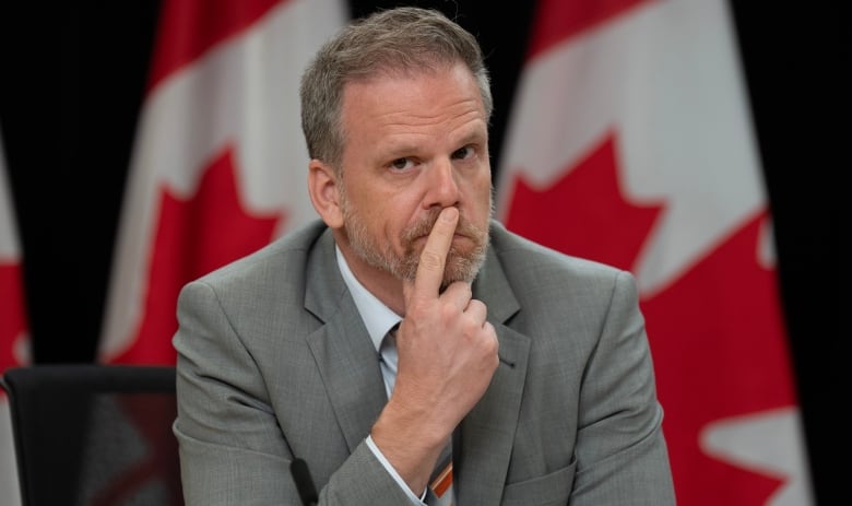 Minister of Health Mark Holland listens to a speaker during a news conference in Ottawa, Tuesday, June 18, 2024.