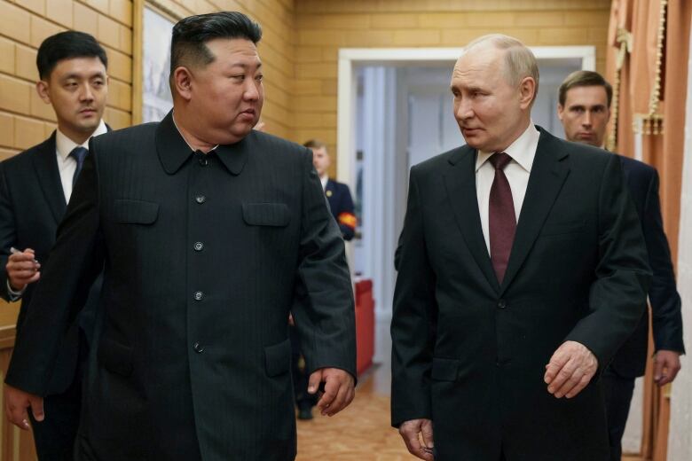 Russian President Vladimir Putin, right, and North Korea's leader Kim Jong Un talk to each other during their meeting in Pyongyang, North Korea, on Tuesday, June 18, 2024. 