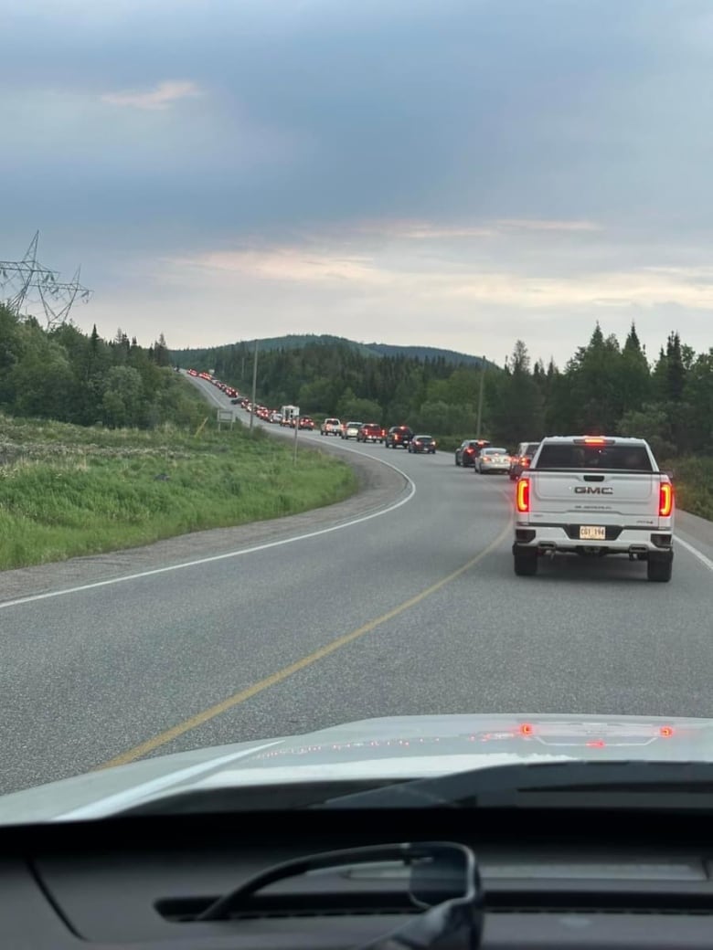 Line up of traffic on highway.