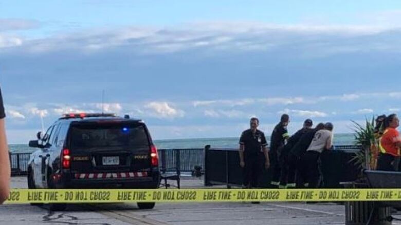 Emergency crews shown near the Leamington pier after a swimmer went missing on Sunday. The body has since been recovered.