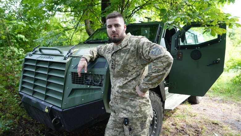 Ukrainian commander Yuriy Fedorenko with one of the Canadian-built Senators near Kharkiv.