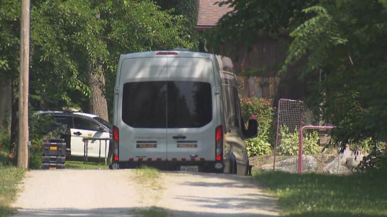 A police vehicle is parked on the Walsh family property near Harrow. 