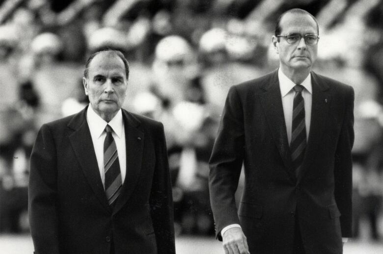 In May 1986, France's then-president Franois Mitterrand and then-prime minister Jacques Chirac are seen attending a ceremony in Paris.